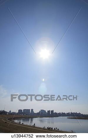 Sun over office buildings and Tama river, Kawasaki city, Kanagawa prefecture, Japan View Large Photo Image Stock Image - Sun over office buildings and Tama river, Kawasaki city, Kanagawa prefecture, Japan. Fotosearch