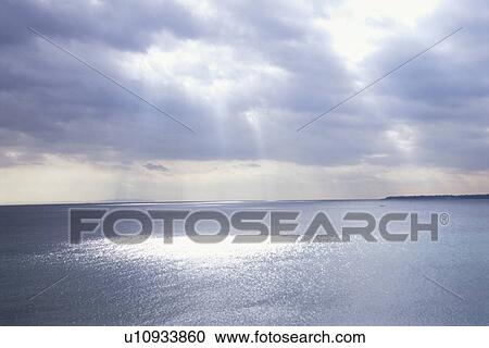 Sun shining through storm clouds. Kanagawa Prefecture, Japan View Large Photo Image Stock Image - Sun shining through storm clouds. Kanagawa Prefecture, Japan. Fotosearch