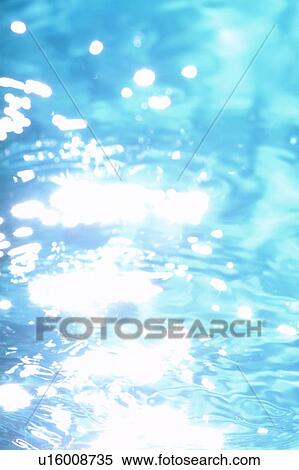 Stock Photography - Sunlight reflecting off water surface. Fotosearch