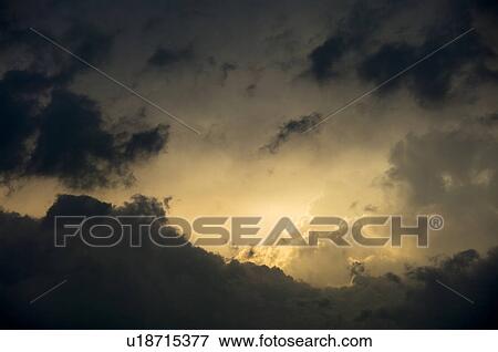 Sunlight Shining on Dark Clouds View Large Photo Image Stock Photo - Sunlight Shining on Dark Clouds. Fotosearch