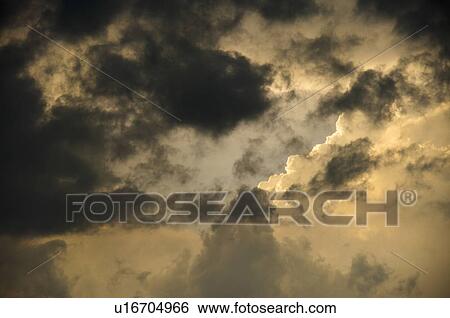Sunlight Shining on Dark Clouds View Large Photo Image Stock Photograph - Sunlight Shining on Dark Clouds. Fotosearch