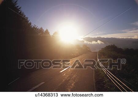 Sunrise over a Highway. Mt. Kuruma Plateau, Nagano Prefecture, Japan View Large Photo Image Stock Image - Sunrise over a Highway. Mt. Kuruma Plateau, Nagano Prefecture, Japan. Fotosearch