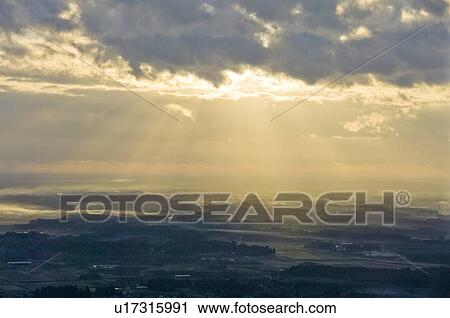 Stock Image - Sunrise over a Town. Fotosearch