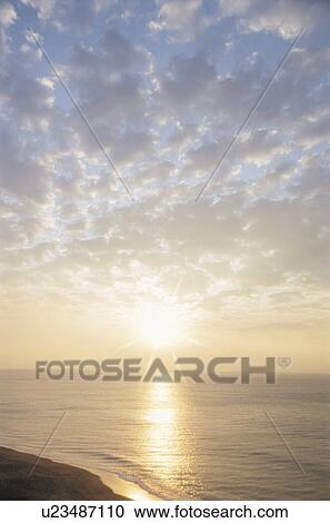 Stock Image - Sunrise over beach, Miura Peninsula, Kanagawa Prefecture, Japan. Fotosearch