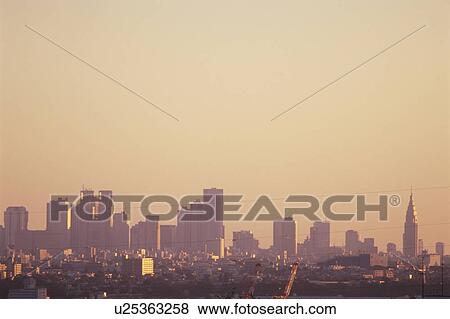 Stock Photo - Sunrise over city. Shinjuku-ku, Tokyo. Fotosearch