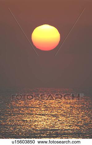 Stock Image - Sunrise Over the Horizon. Fotosearch