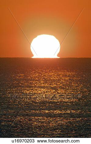 Stock Image - Sunrise Over the Horizon. Fotosearch