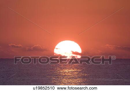 Stock Image - Sunrise Over the Horizon. Fotosearch