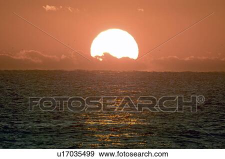 Stock Photo - Sunrise Over the Horizon. Fotosearch