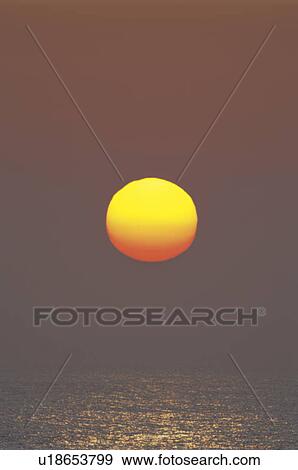 Stock Photo - Sunrise Over the Horizon. Fotosearch