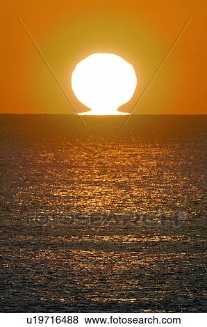 Stock Photo - Sunrise Over the Horizon. Fotosearch