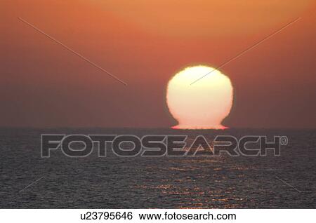 Stock Photograph - Sunrise Over the Horizon. Fotosearch