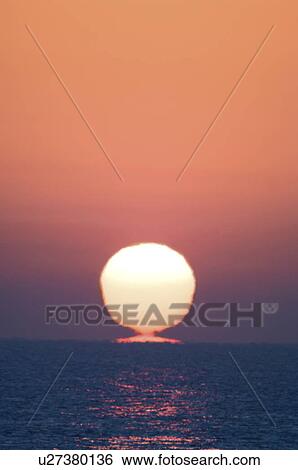 Stock Photograph - Sunrise Over the Horizon. Fotosearch