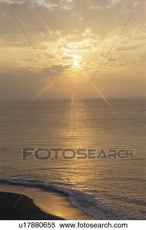 Stock Photography - Sunrise over the sea. Kanagawa Prefecture, Miura Peninsula, Japan. Fotosearch