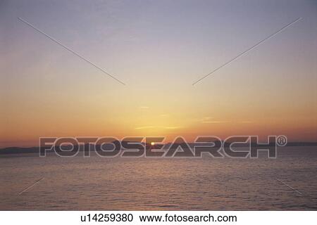 Stock Image - Sunrise over the sea. Miura Peninsula, Kanagawa Prefecture, Japan. Fotosearch