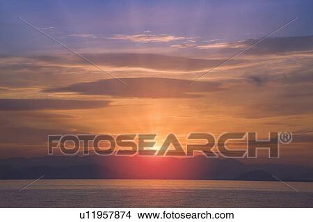 Picture - Sunrise over the water. Otsu, Shiga Prefecture, Japan. Fotosearch