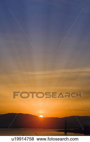 Stock Photo - Sunrise over the water. Otsu, Shiga Prefecture, Japan. Fotosearch
