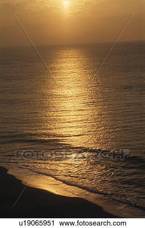 Stock Image - Sunrise reflected on the sea. Miura Peninsula, Kanagawa Prefecture, Japan. Fotosearch