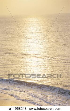 Stock Photo - Sunrise reflected on the sea. Miura Peninsula, Kanagawa Prefecture, Japan. Fotosearch