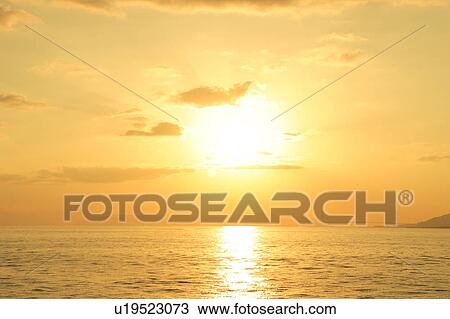 Stock Image - Sunset Over Ocean. Fotosearch