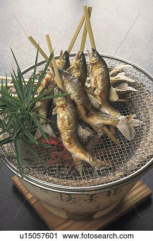 Sweetfish grilled with salt on a charcoal brazier View Large Photo Image Stock Image - Sweetfish grilled with salt on a charcoal brazier. Fotosearch