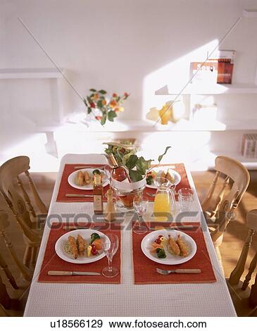 Stock Photo - Table arrangement with four meals. Fotosearch