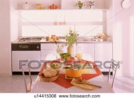 Stock Photo - Table setting with casserole and bread. Fotosearch