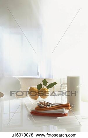 Stock Photo - Table with lemon bowl and napkins. Fotosearch