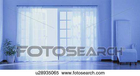 Stock Photography - Tall white chair beside window. Fotosearch