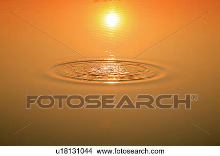 Picture - Tama river in sunset color, close up, Tokyo prefecture, Japan. Fotosearch