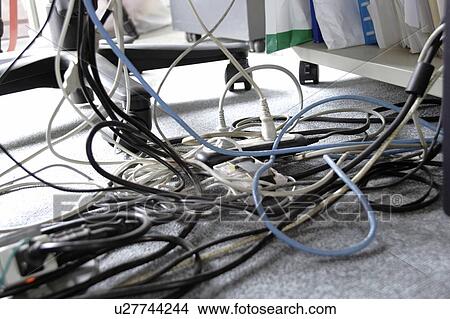 Tangled cables under desk View Large Photo Image Picture - Tangled cables under desk. Fotosearch
