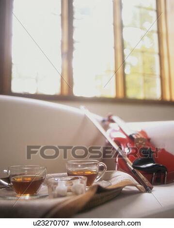 Stock Photo - Tea for two and a violin for one. Fotosearch