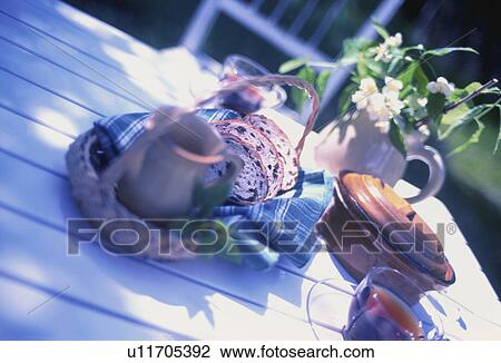 Stock Image - Tea served in a cottage garden. Fotosearch