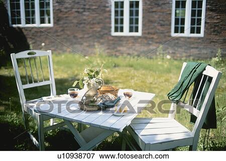 Stock Photo - Tea served in a cottage garden. Fotosearch