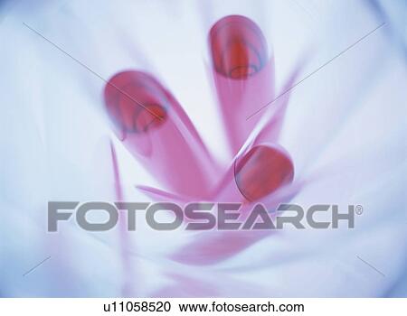 Stock Image - Test tubes with red liquid, close up. Fotosearch