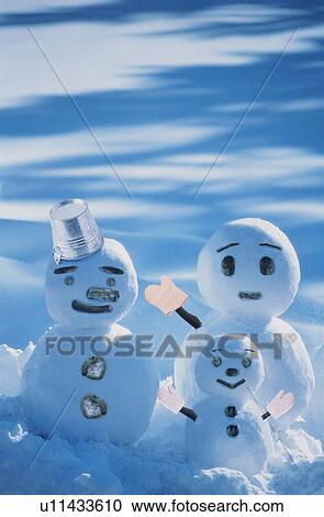 Three snowmen in the snow View Large Photo Image Stock Image - Three snowmen in the snow. Fotosearch