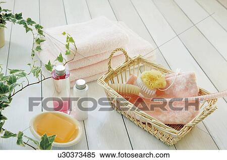 Stock Photography - Toiletries in a basket and towels. Fotosearch