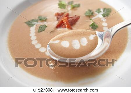 Stock Image - Tomato potage in bowl. Fotosearch