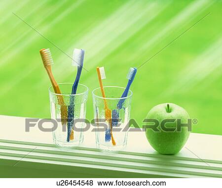 Stock Photo - Toothbrushes in glasses and apple on window sill, computer graphic. Fotosearch