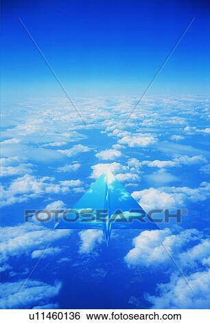 Stock Photograph - Transparent paper airplane in the sky. Fotosearch