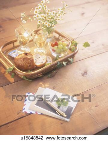 Tray of bread and wine with mail to read View Large Photo Image Stock Image - Tray of bread and wine with mail to read. Fotosearch