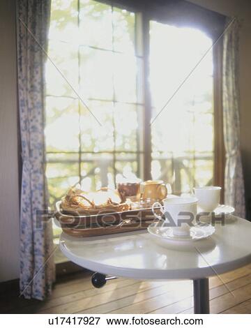 Two coffee cups and a breakfast tray on a table View Large Photo Image Stock Photo - Two coffee cups and a breakfast tray on a table. Fotosearch