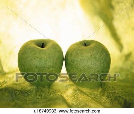 Stock Image - Two green apples. Fotosearch