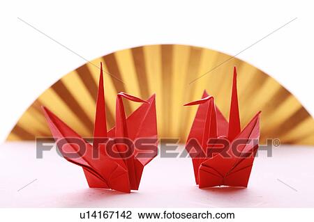 Stock Image - Two Origami birds, white background. Fotosearch