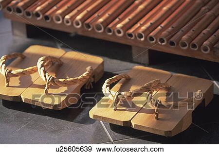 Stock Photo - Two pairs of Geta sandals. Fotosearch