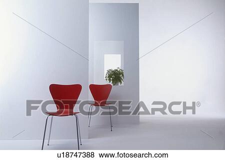 Stock Photo - Two red chairs in modern room. Fotosearch