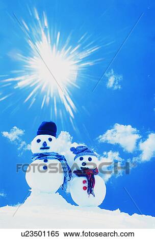 Stock Photography - Two snowmen in the snow. Fotosearch