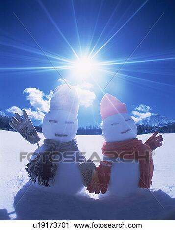 Two snowmen in the sun View Large Photo Image Stock Image - Two snowmen in the sun. Fotosearch