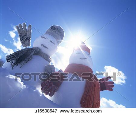 Stock Photo - Two snowmen in the sun. Fotosearch