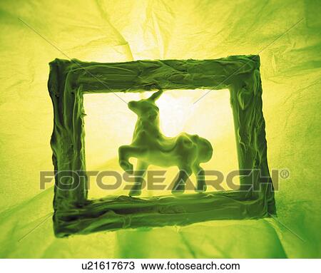 Unicorn figurine in a picture frame View Large Photo Image Stock Image - Unicorn figurine in a picture frame. Fotosearch
